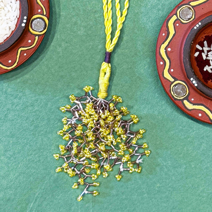 Handmade Reusable Yellow Corel And Jhumki Rakhi For Bhabhi - Close-up of Pendant Detail