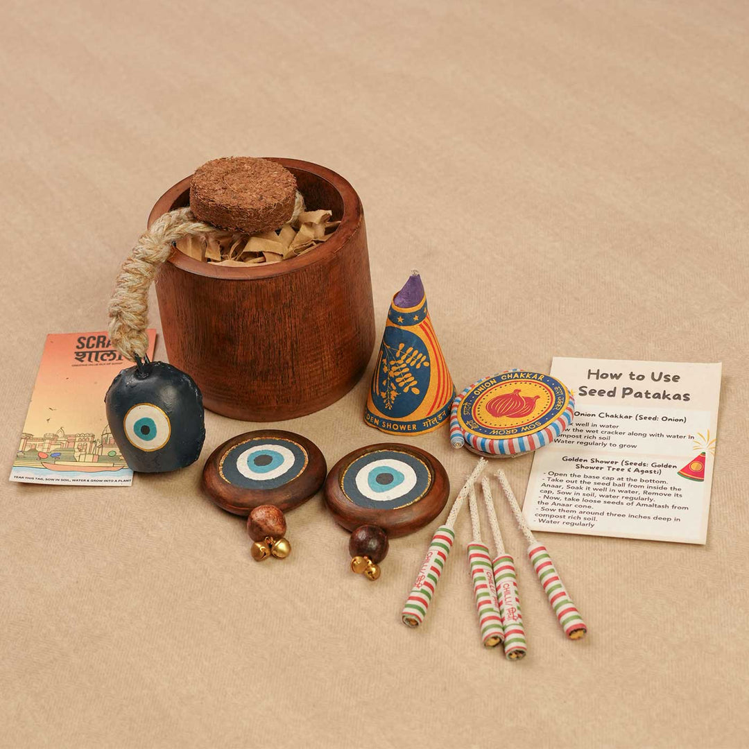 Handmade Samriddhi Gift Hamper | Includes Evil Eye Door Hanging, Evil Eye Bell Hanging, Wooden Planter, Cocopeat, Seed Crackers, Cracker Instruction Card, Seed Card And Outer Box