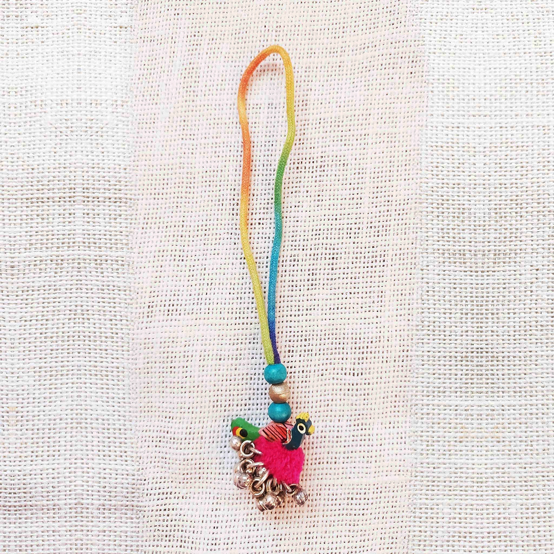 Handmade Dori Work Peacock And Ghungroo Bhaiya Bhabhi Rakhi With Roli Chawal Set Of 2 - Single ornament charm hanging view
