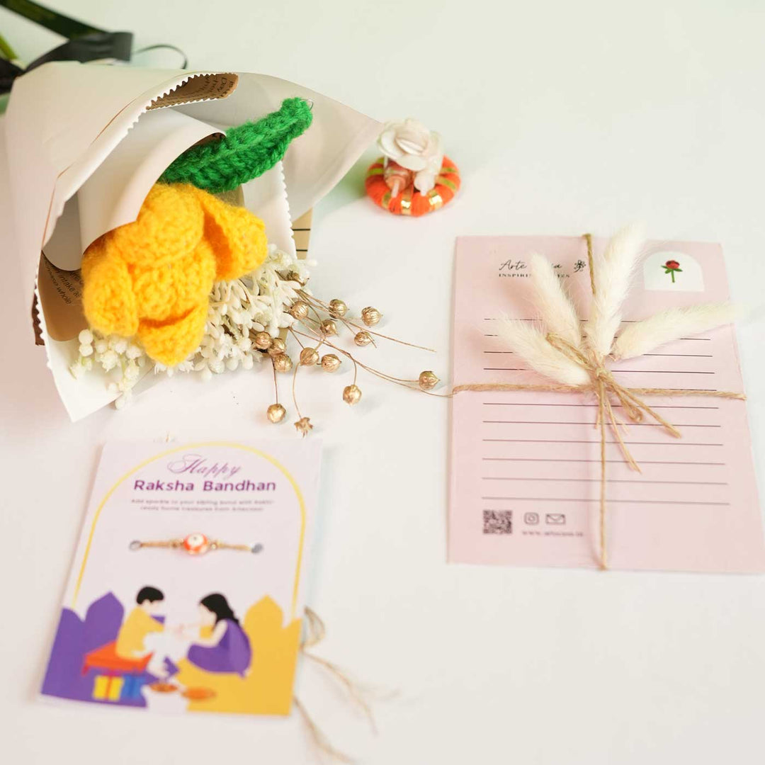 Personalized Handmade Crochet Tulip Dried Bunch Rakhi Hamper Includes 1 Crochet Flower Bunch 1 Message Card And 1 Rakhi And Roli Chawal - Flat Lay with Accessories