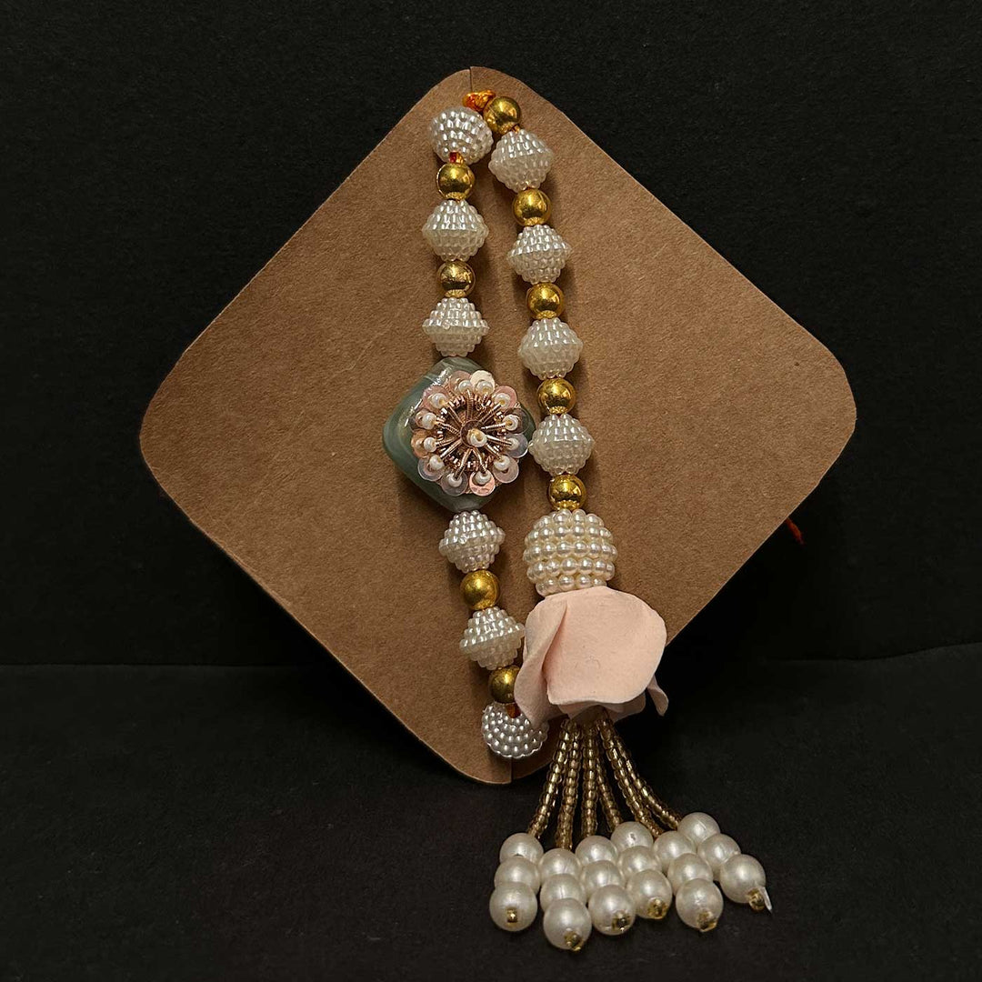 Handmade Riwaayat Duo Rakhi Hamper Includes 1 Marble Lotus 2 Kulhads 1 Candle 1 Kum Kum Chawal 1 Dry Fruit Potli And 1 Set Bhaiya Bhabhi Rakhi - Close-up of Rakhi Set