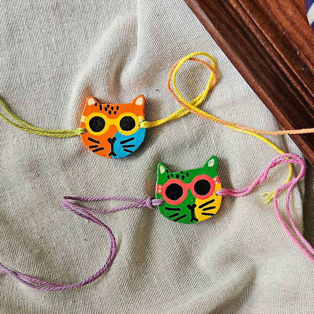 Handpainted Quirky Wooden Rakhi With Roli Chawal 16 - Two cat bracelets together