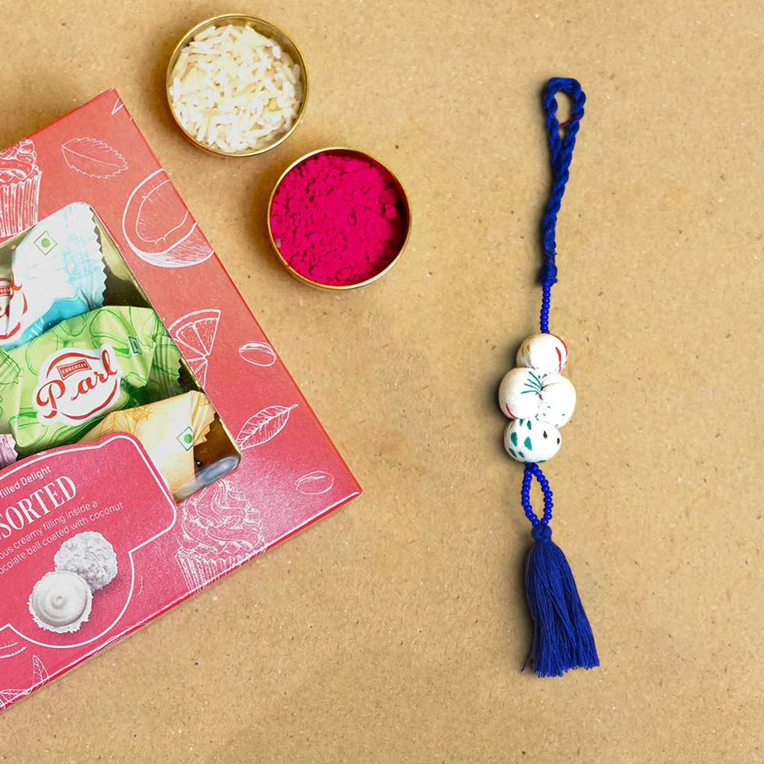 Handmade Shweth Potli Upcycled Fabric Lumba Rakhi for Bhabhi With Roli Chawal