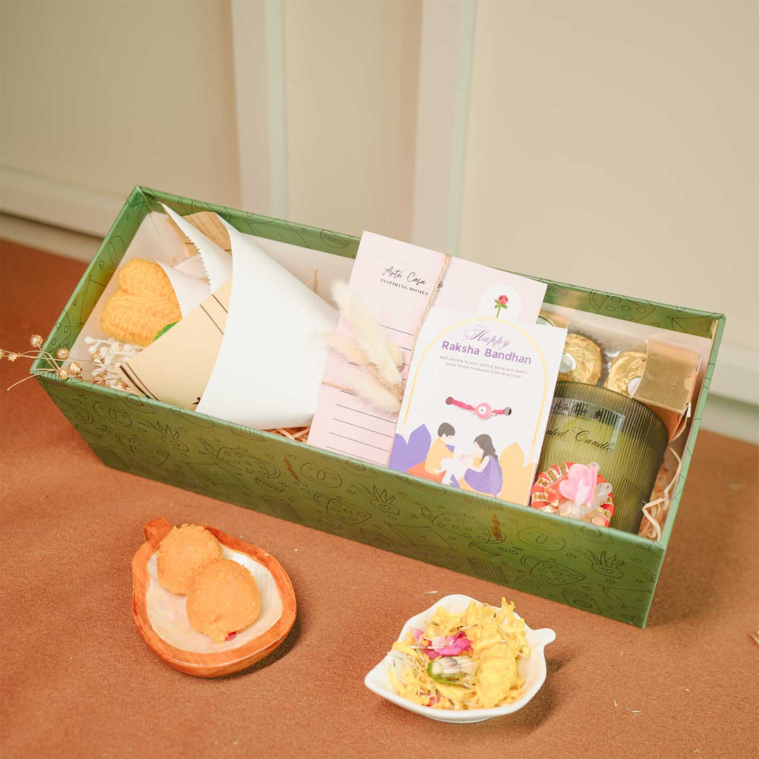 Personalized Handmade Crochet Flower Lover Rakhi Hamper Includes 1 Gift Box 1 Crochet Flower 1 Rakhis 1 Roli Chawal 1 Candle And 1 Message Card - Gift Box with All Contents Visible