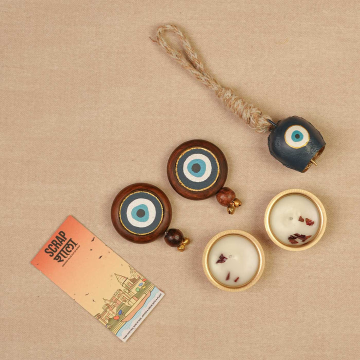 Handmade Nazar Jyoti Gift Hamper | Includes Evil Eye Door Hanging, Evil Eye Bell Hanging, Gold Soy Wax Candles, Seed Card And Outer Box