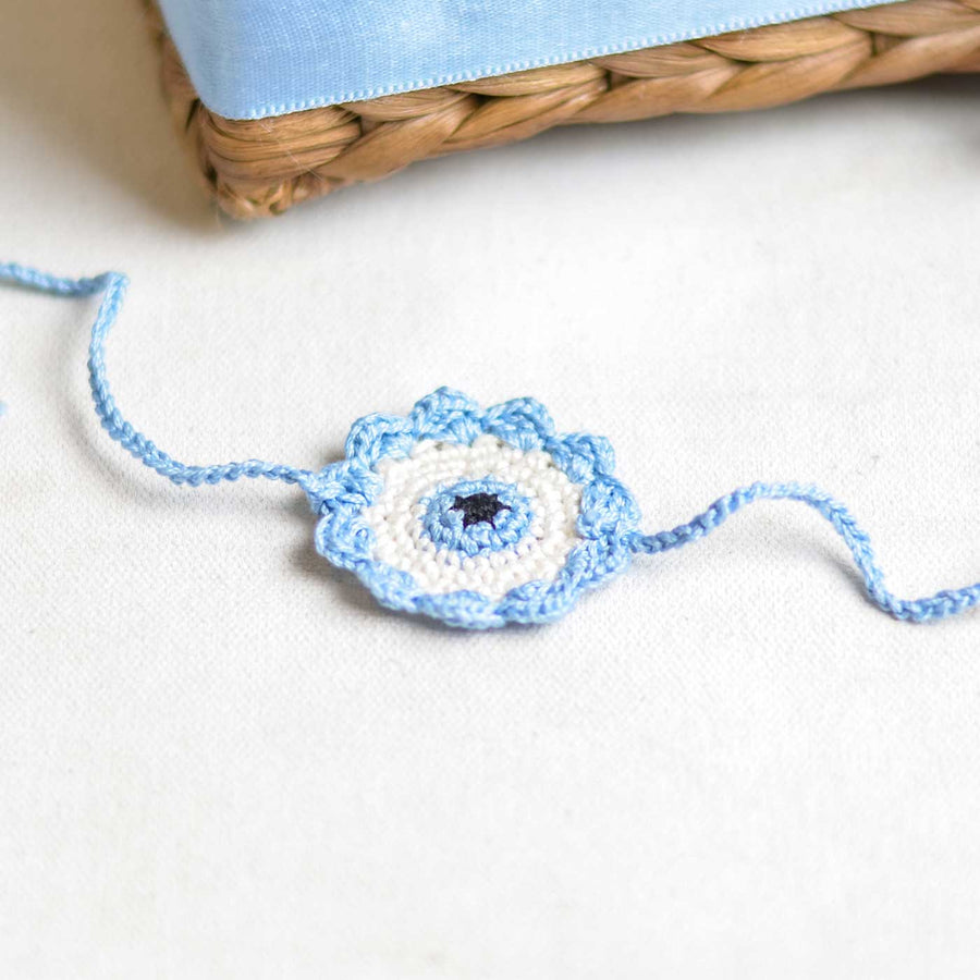 Handmade Crochet Evil Eye Design Cotton Rakhi - Close-up on Crochet Bracelet