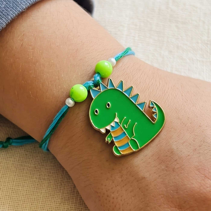 Engraved Little Dinosaur Enamel Metal Charm Rakhi With Roli Chawal for Brother