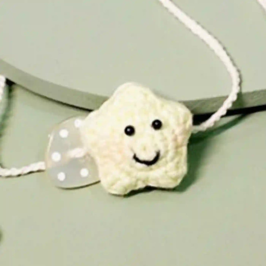 Handmade Crochet Little Star Kids Rakhi With Roli Chawal For Newborns - Yellow Star Bracelet Close-up