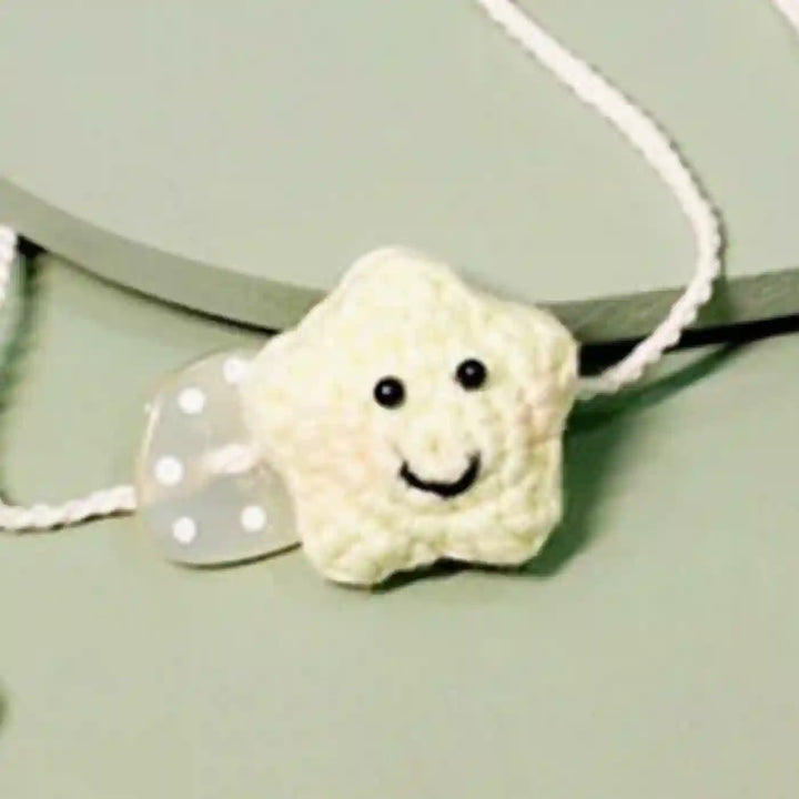 Handmade Crochet Little Star Kids Rakhi With Roli Chawal For Newborns - Yellow Star Bracelet Close-up