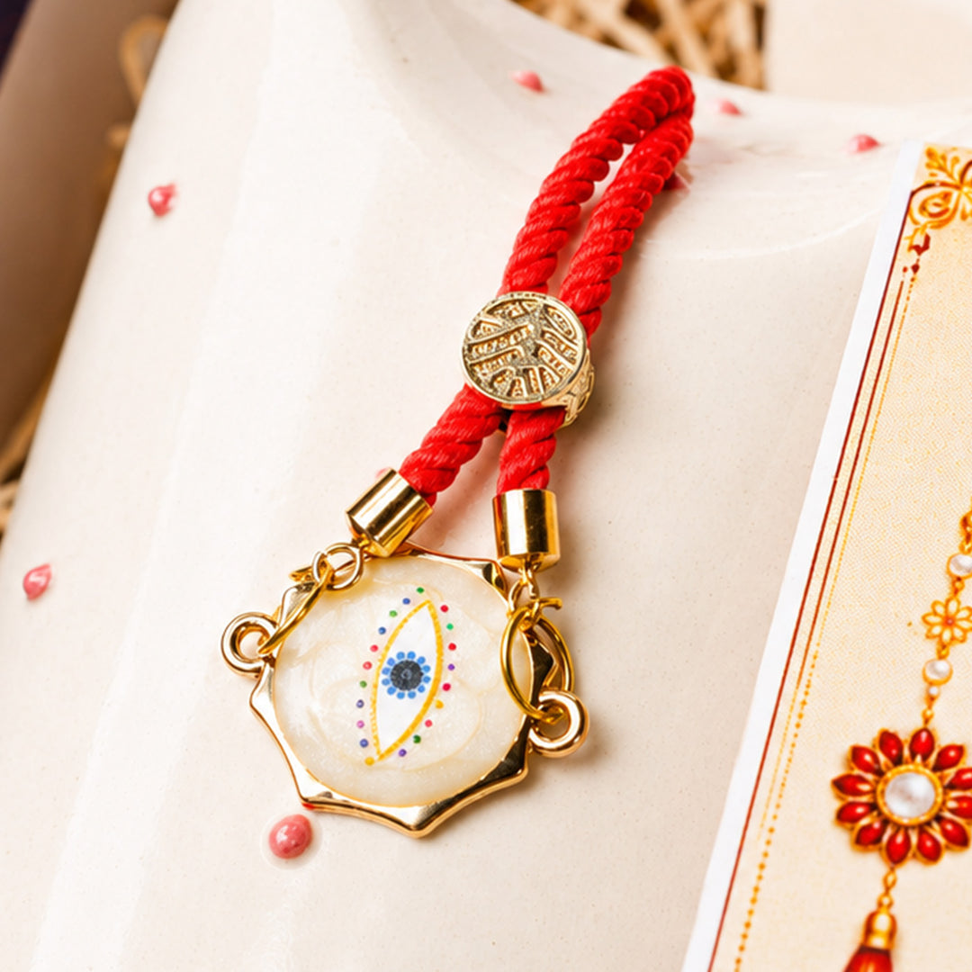 "Heartfelt Sibling Love" Jar Ceramic Rakhi Hamper With Red Sipper & Evil Eye Rakhi For Brother