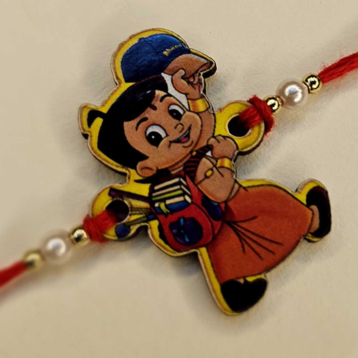 Handmade Chota Bheem Mdf Wood Kids Rakhi With Roli Chawal - Angled Close-up Showing Details