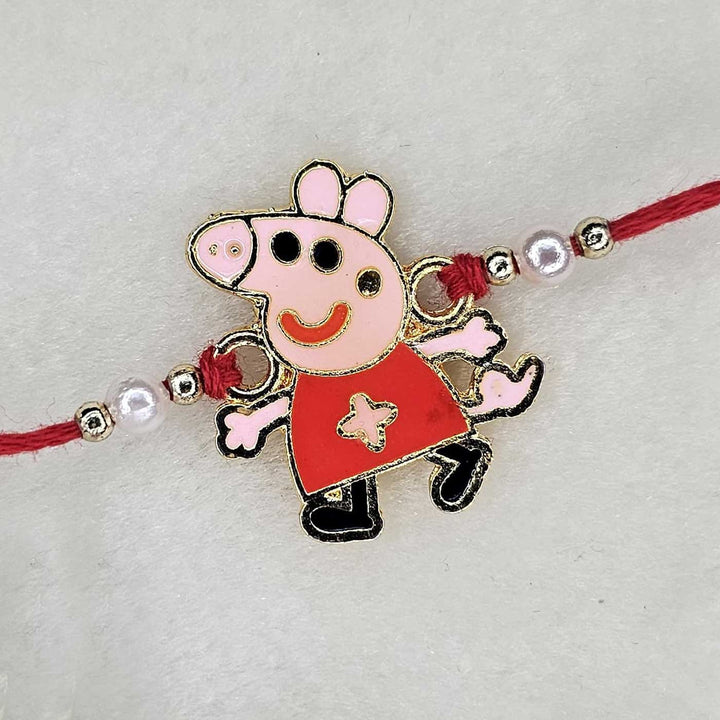 Handmade Peppa Pig Theme Metal Kids Rakhi With Roli Chawal - Front View of Bracelet Charm
