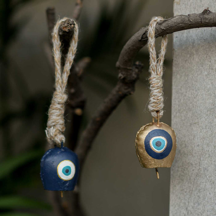 Handmade Nazar Jyoti Gift Hamper | Includes Evil Eye Door Hanging, Evil Eye Bell Hanging, Gold Soy Wax Candles, Seed Card And Outer Box