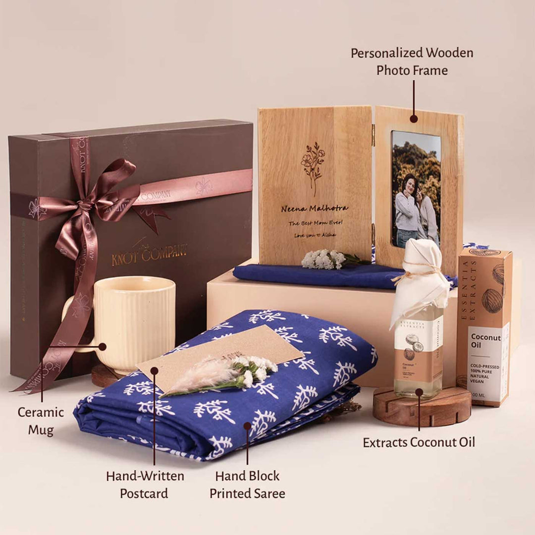 Photo Personalized For the Heart of Our Home Gift Hamper | Includes 1 Hand Block Printed Saree with Unstitched Blouse, 1 Wooden Photo Frame, 1 Ribbed & Glazed Ceramic Mug, 1 Coconut Oil, 1 Mother’s Day Handwritten Postcard, 1 Classic Gift Box