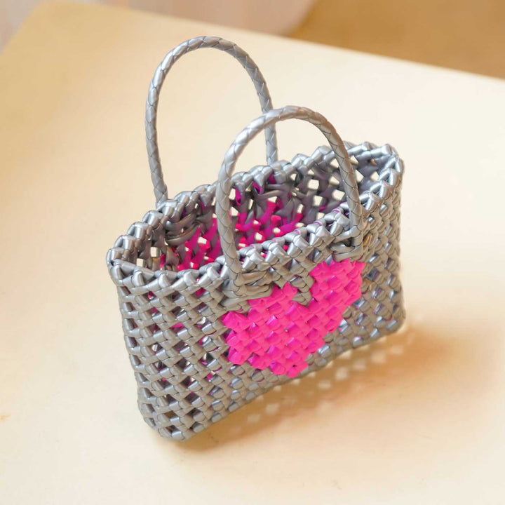 Handwoven Grey Small Plastic Wire Koodai Bag With Pink Heart Motif For Festive Return Gifts