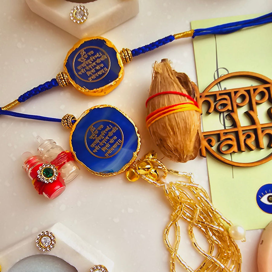 Handmade Gayatri Mantra Agate Bhaiya Bhabhi Rakhi With Roli Chawal - Close-up of Rakhi pair with accessories