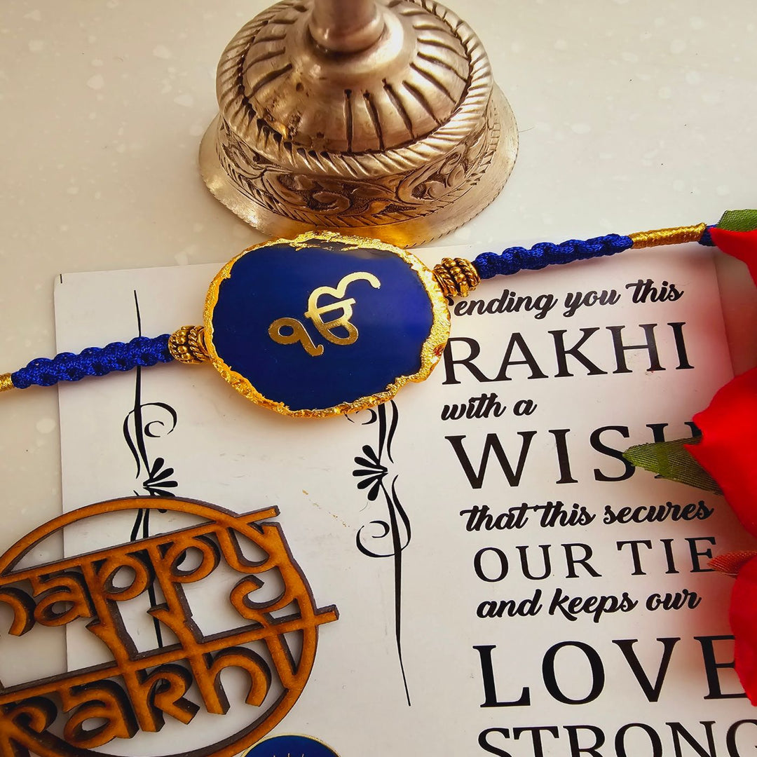 Handmade Ik Onkar Agate Rakhi With Roli Chawal For Brother - Front View of Blue Rakhi on Card