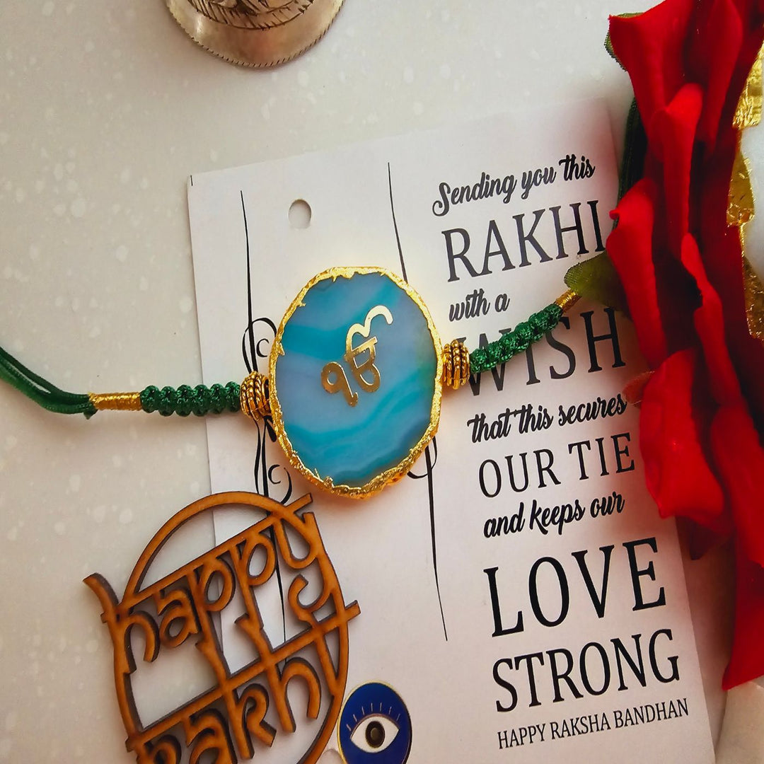 Handmade Ik Onkar Agate Rakhi With Roli Chawal For Brother - Front View of Rakhi on Card