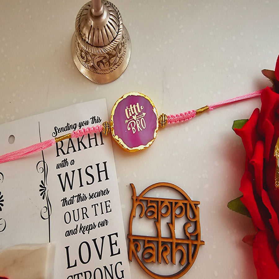 Handmade Pink Lil Bro Agate Rakhi With Roli Chawal For Brother - Front View with Tag and Decorations