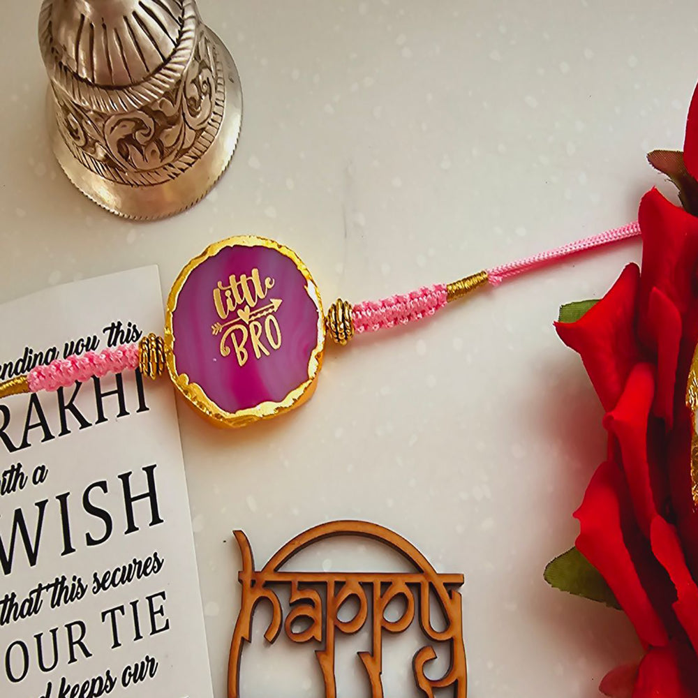 Handmade Pink Lil Bro Agate Rakhi With Roli Chawal For Brother - Close-Up of Rakhi Thread and Beads