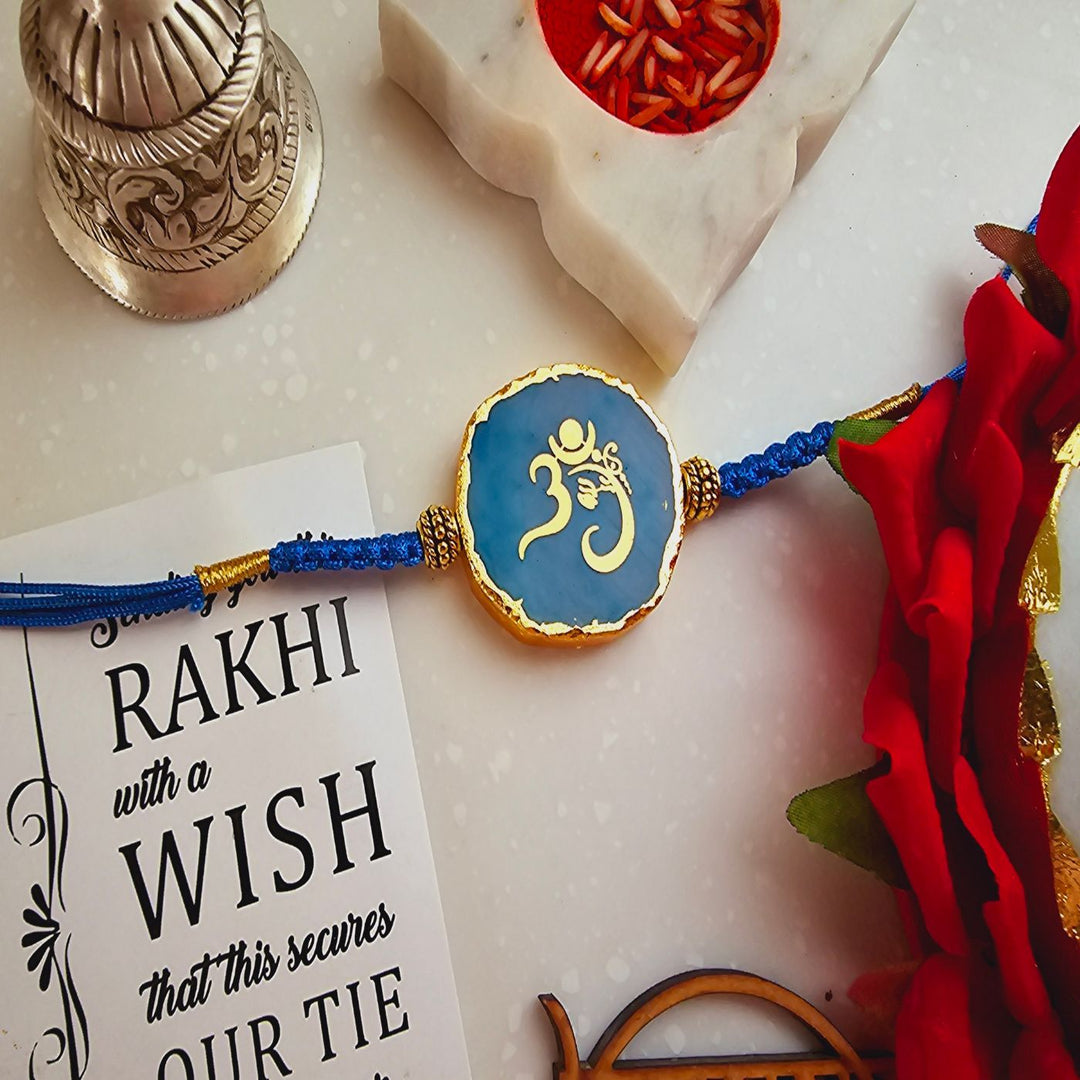 Handmade Om Agate Rakhi With Roli Chawal For Brother - Blue Rakhi Close-up with Card