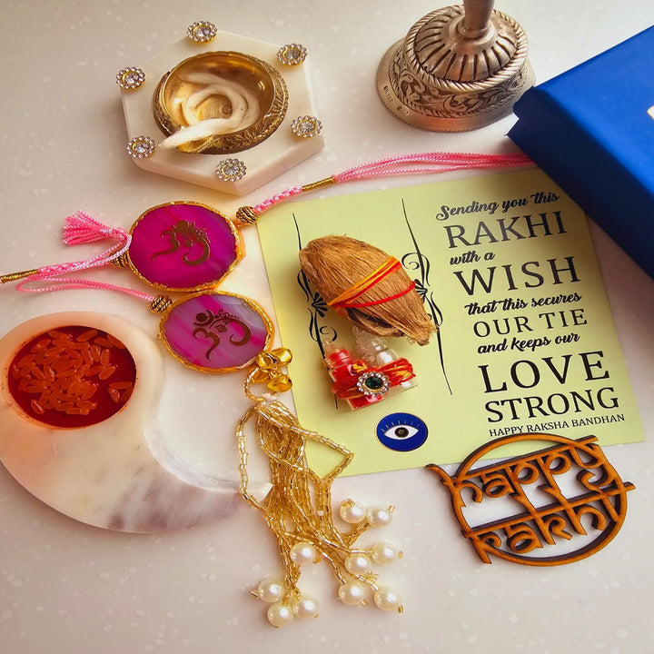 Handmade Om Agate Bhaiya Bhabhi Rakhi With Roli Chawal - Pink Rakhi Set Display