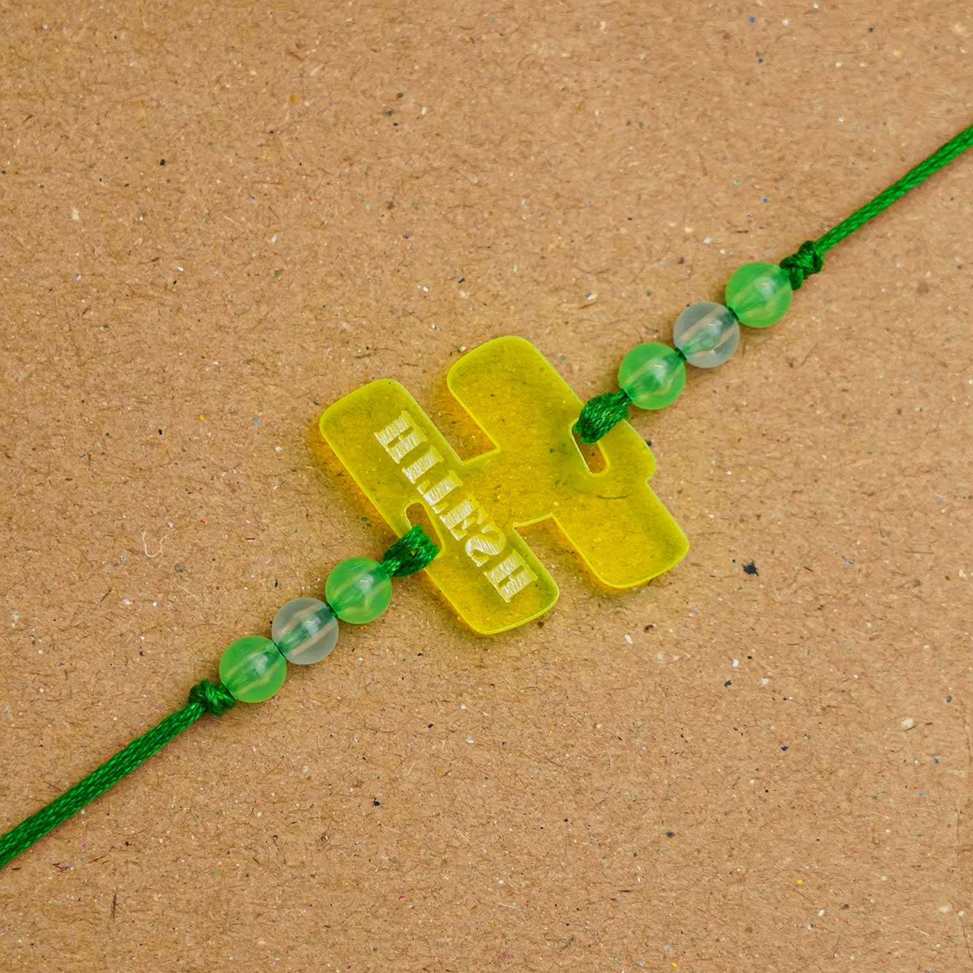Buy Personalized Handmade Alphabet Name Acrylic Rakhi With Roli Chawal ...
