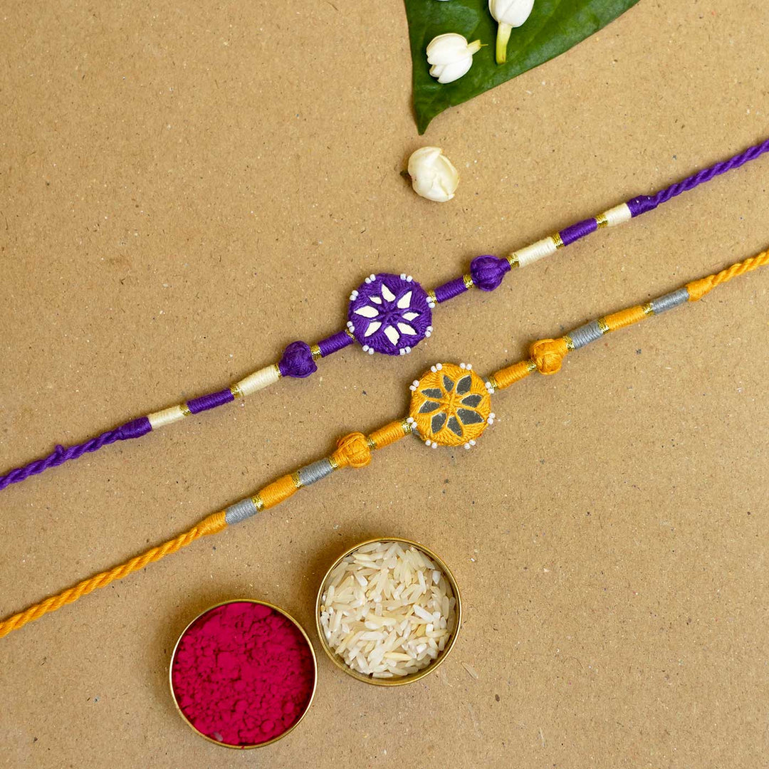 Handmade Mirror Work Patwa Purple-Yellow Cotton Rakhi  With Roli Chawal | Set of 2