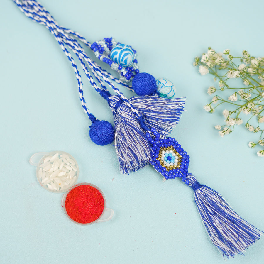 Handmade Reusable Evil Eye Beads And Jhumki Lumba Rakhi For Bhabhi For Bhaiya And Bhabhi - Close-up with Accessories