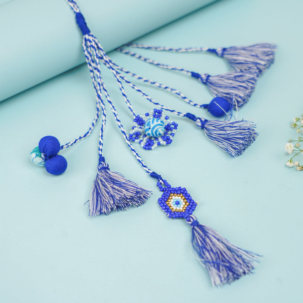 Handmade Reusable Evil Eye Beads And Jhumki Rakhi And Lumba For Bhaiya And Bhabhi - Flat Lay Showing Multiple Tassels