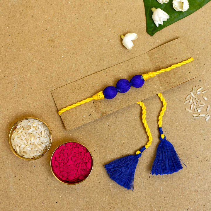 Handmade Bright Yellow Upcycled Fabric  Rakhi  With Roli Chawal