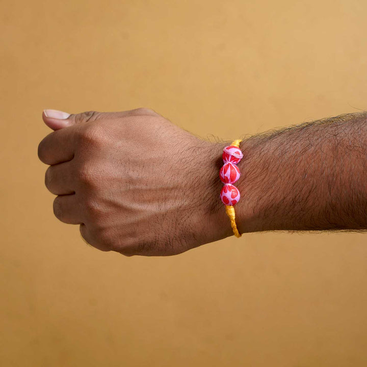 Handmade Ochre Upcycled Fabric  Rakhi  With Roli Chawal