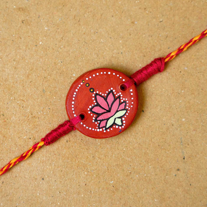 Hand-painted Kamal Terracotta Rakhi  With Roli Chawal