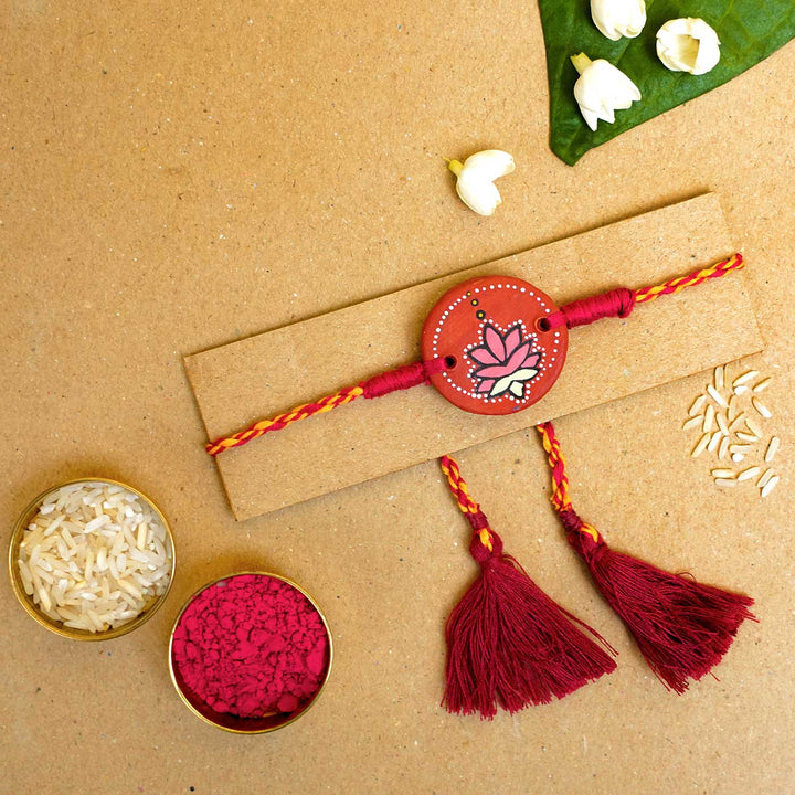 Hand-painted Kamal Terracotta Rakhi  With Roli Chawal