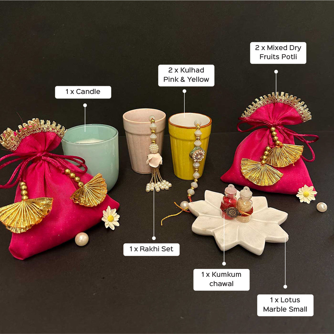 Handmade Riwaayat Duo Rakhi Hamper Includes 1 Marble Lotus 2 Kulhads 1 Candle 1 Kum Kum Chawal 1 Dry Fruit Potli And 1 Set Bhaiya Bhabhi Rakhi - Product Components Labeled