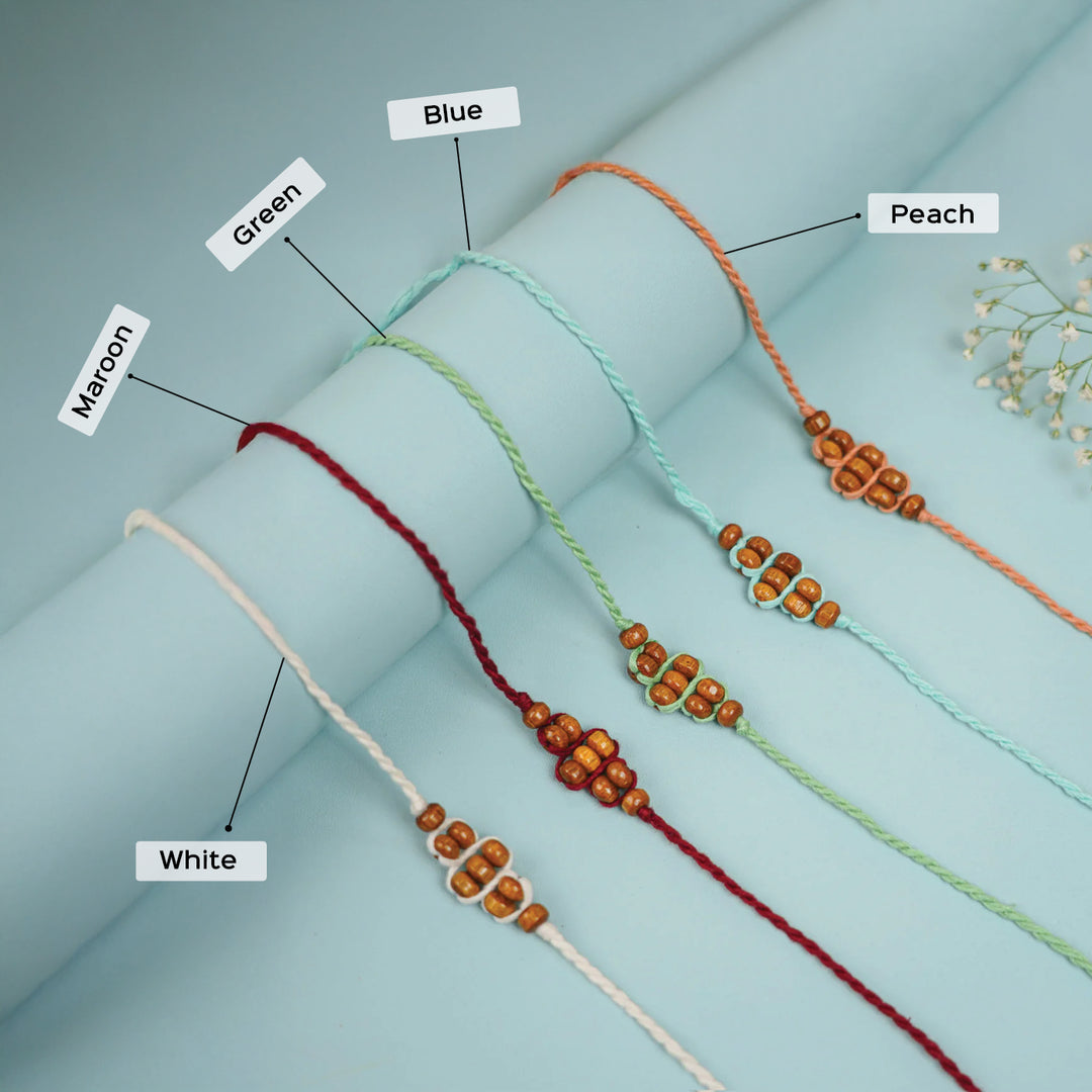 Handmade Beaded Minimalist Rakhi With Roli Chawal - Color labeled bracelet display