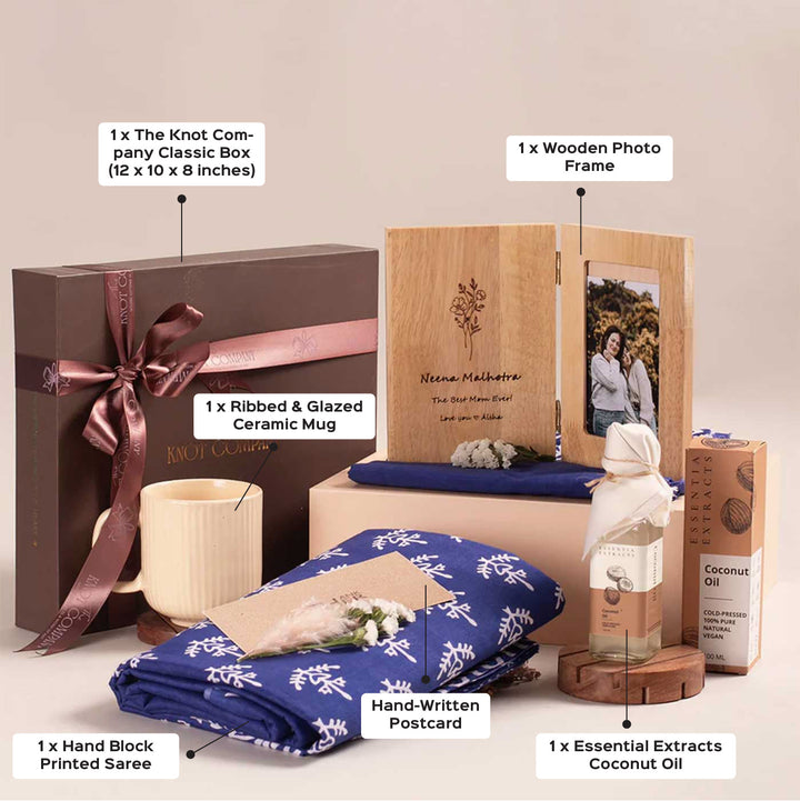 Photo Personalized For the Heart of Our Home Gift Hamper | Includes 1 Hand Block Printed Saree with Unstitched Blouse, 1 Wooden Photo Frame, 1 Ribbed & Glazed Ceramic Mug, 1 Coconut Oil, 1 Mother’s Day Handwritten Postcard, 1 Classic Gift Box