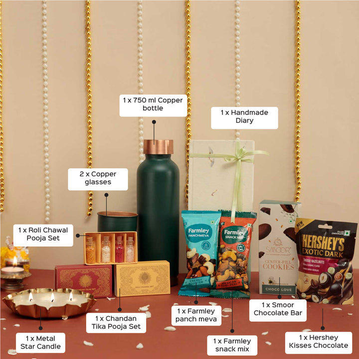 Handmade Umang Gift Hamper | Includes 1 Bottle, 2 Glasses, 1 Chocolate, 1 Chocolate Bar, 2 Dry Fruit, 1 Diary, 1 Candle, 1 X Roli Chawal, 1 Pooja Set,1 Card And 1Box