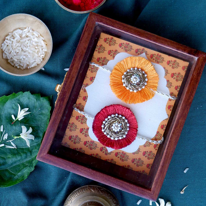 Handmade Zardozi Surajmukhi Rakhi With Wooden Box And Roli Chawal Set Of 2 - In decorative box packaging