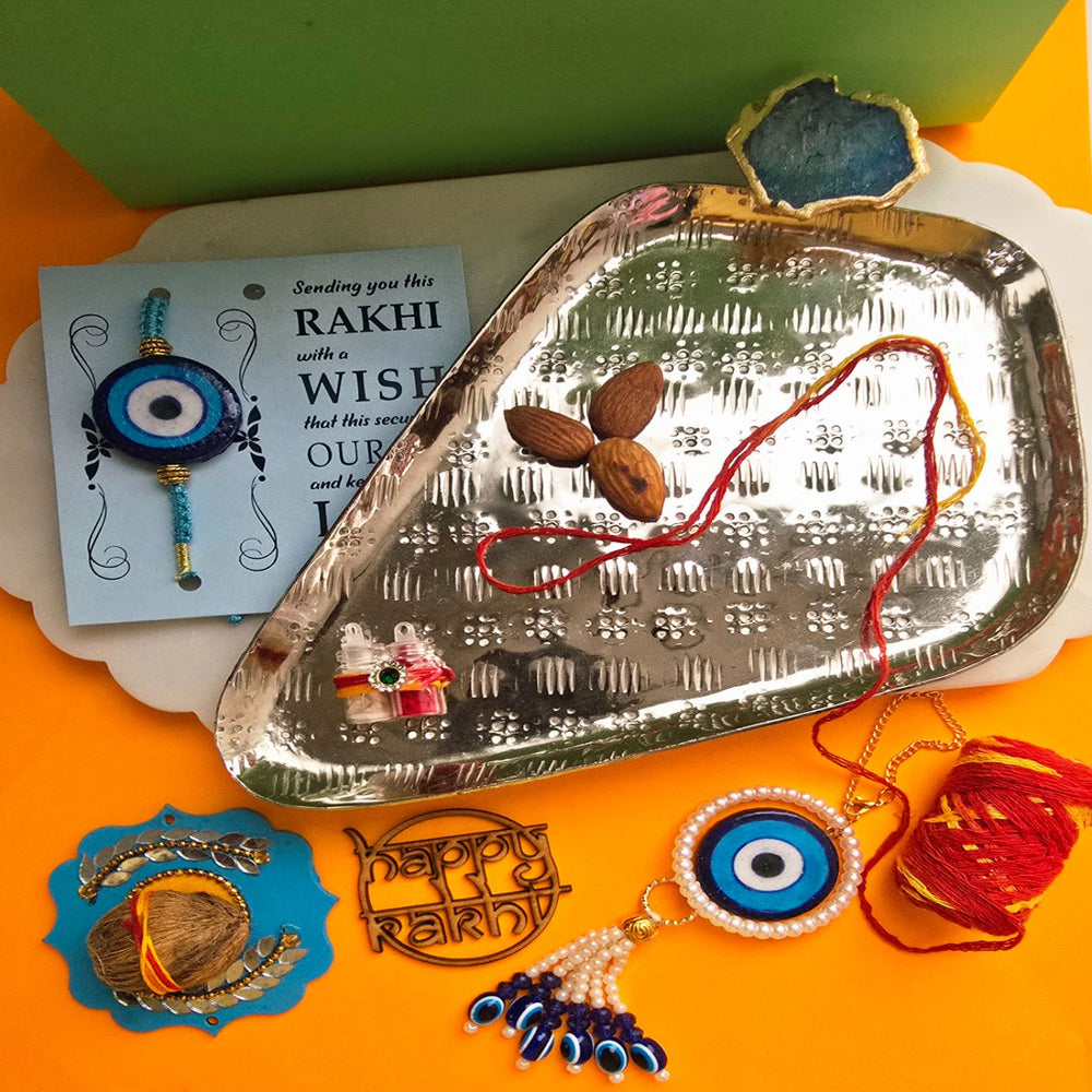 Handmade Blue Pottery Evil Eye Ceramic Bhaiya Bhabhi Rakhi With Roli Chawal - Items Laid Out on Tray with Accessories