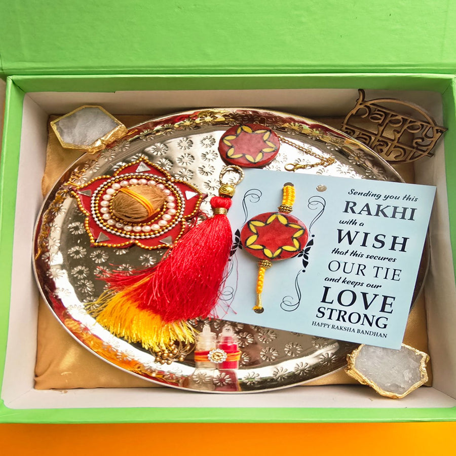 Handmade Red Florwer Design Ceramic Bhaiya Bhabhi Rakhi With Roli Chawal 1 - In Packaging