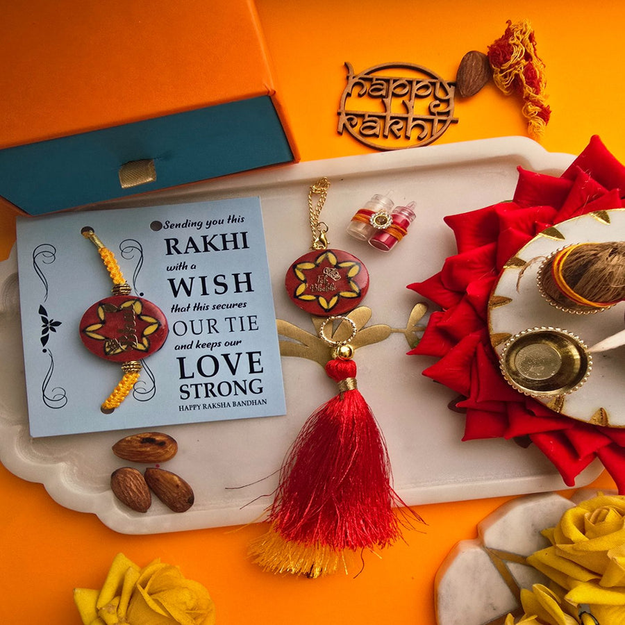 Handmade Laser Cut Red Bhai And Fab Bhabhi Ceramic Bhaiya Bhabhi Rakhi With Roli Chawal - Rakhi and Wish Card Display