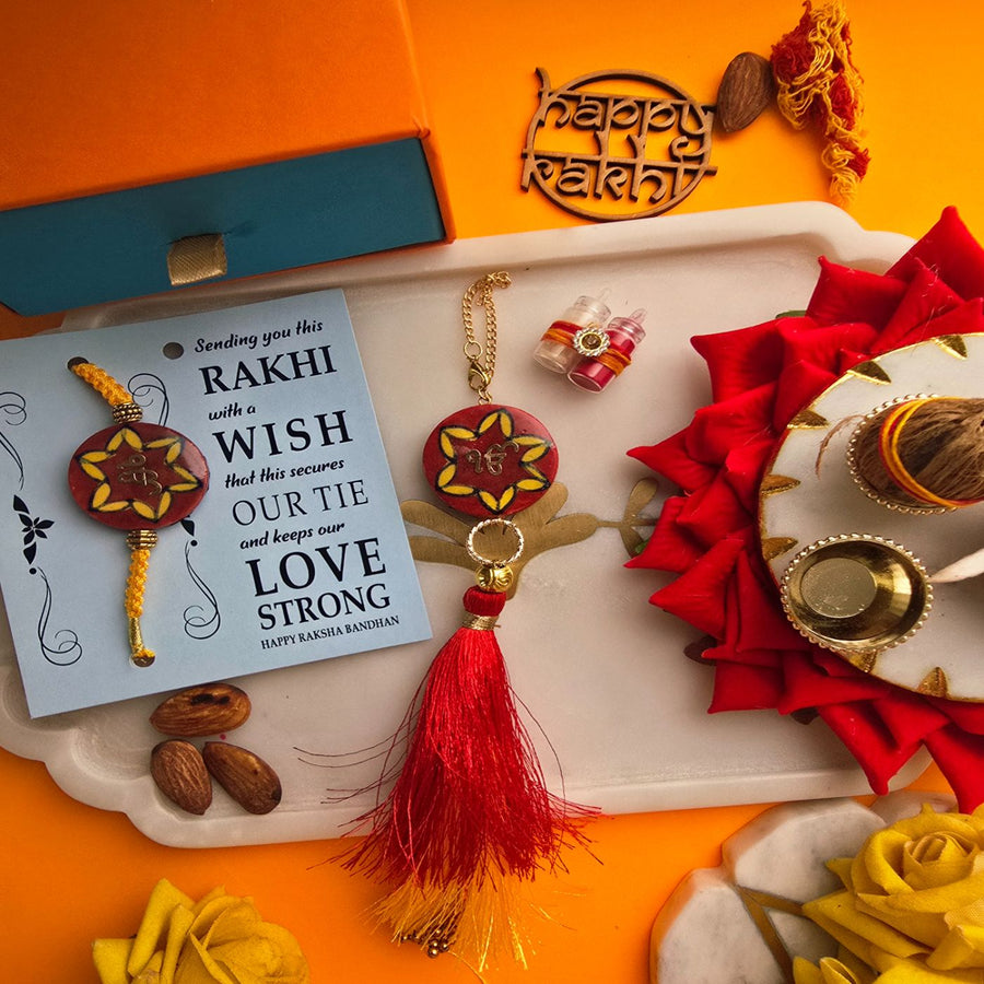 Handmade Laser Cut Red Ik Onkar Ceramic Bhaiya Bhabhi Rakhi With Roli Chawal - Styled with Rakhi and Card
