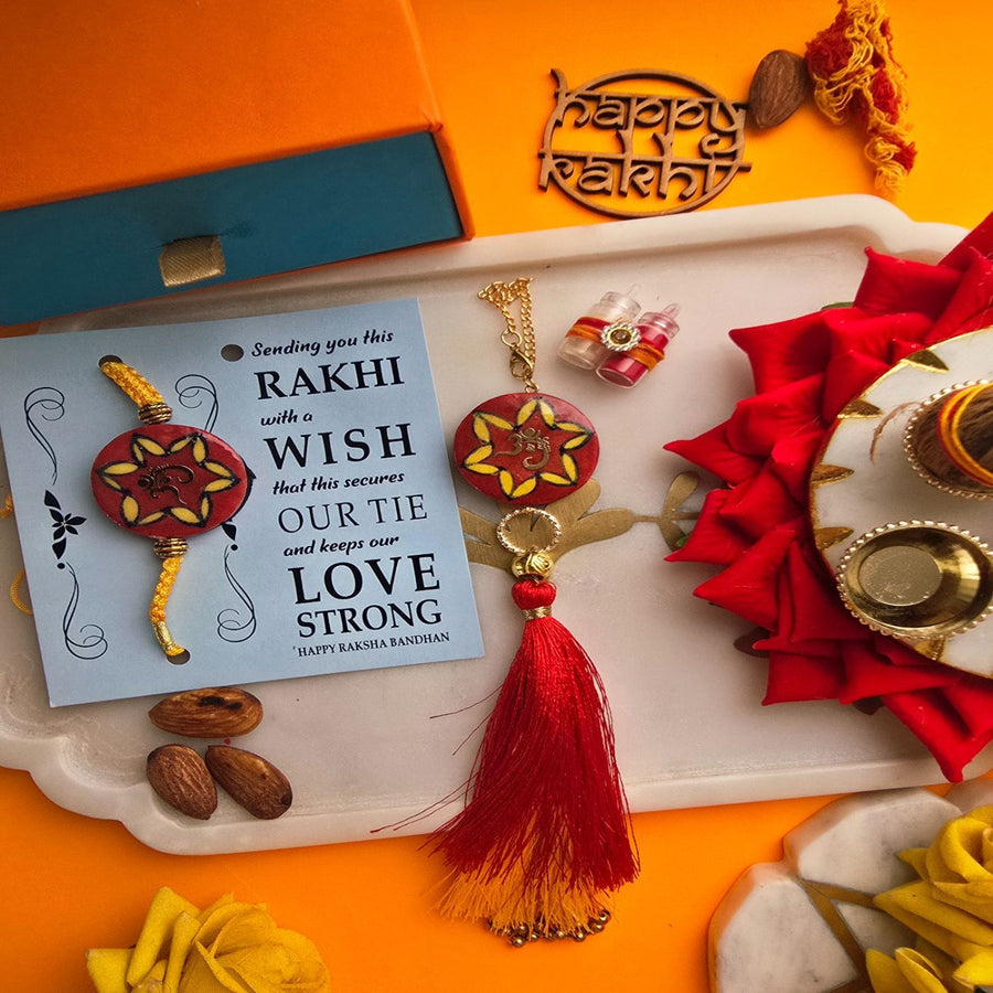 Handmade Laser Cut Red Om Ceramic Bhaiya Bhabhi Rakhi With Roli Chawal - Rakhi with Wish Card Display
