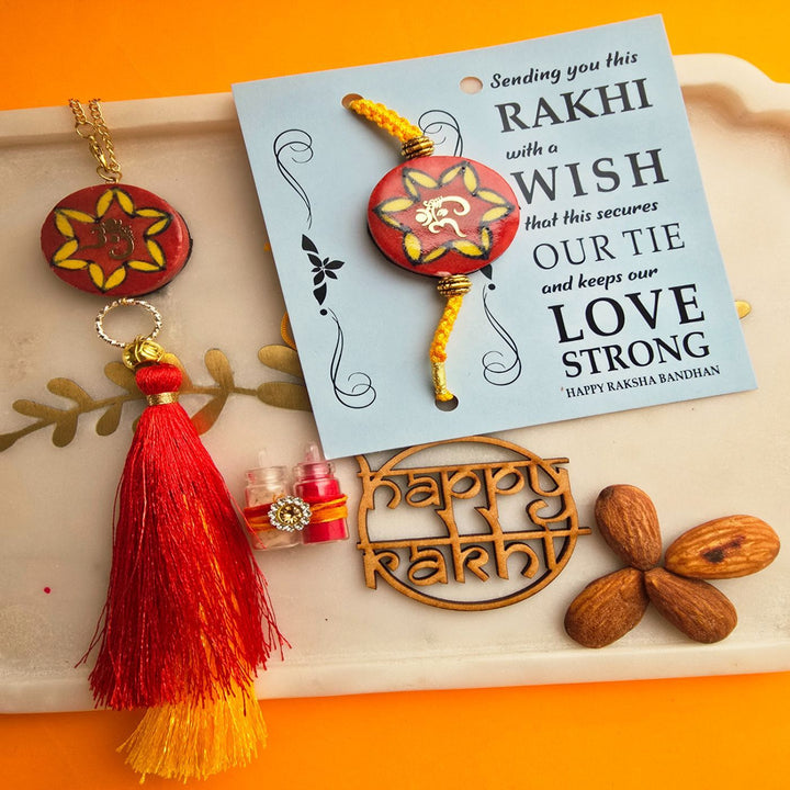 Handmade Laser Cut Red Om Ceramic Bhaiya Bhabhi Rakhi With Roli Chawal - Rakhi and Tikka Items Close-up