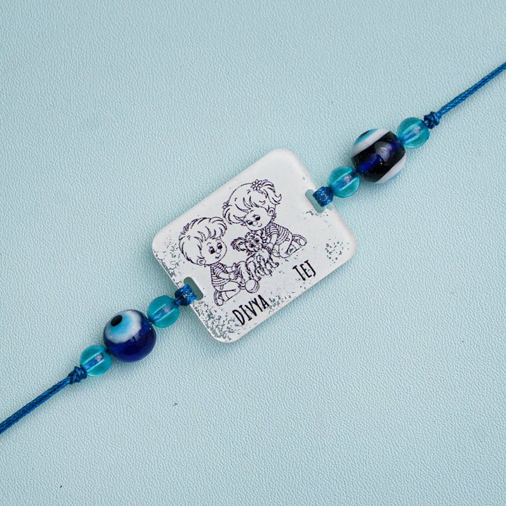 Personalized Handmade 3D Line Art Bro And Sis Evil Eye Beads Acrylic Rakhi With Roli Chawal - Engraving Close-up (5)