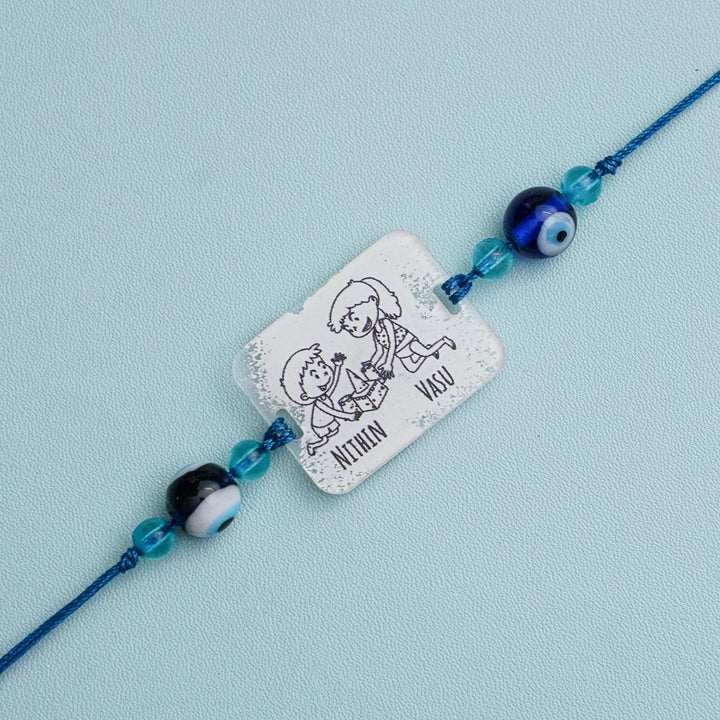Personalized Handmade 3D Line Art Bro And Sis Evil Eye Beads Acrylic Rakhi With Roli Chawal - Engraving Close-up