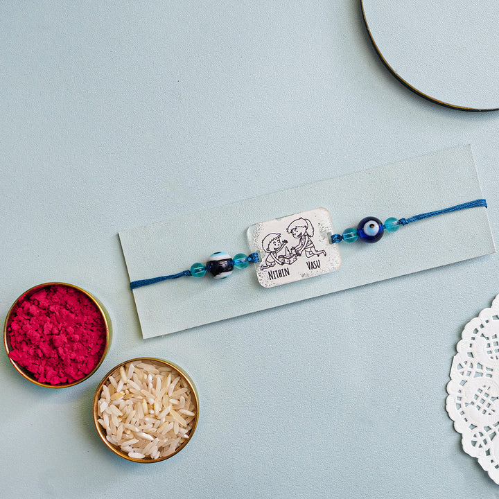 Personalized Handmade 3D Line Art Bro And Sis Evil Eye Beads Acrylic Rakhi With Roli Chawal - Mounted on Card with Accessories