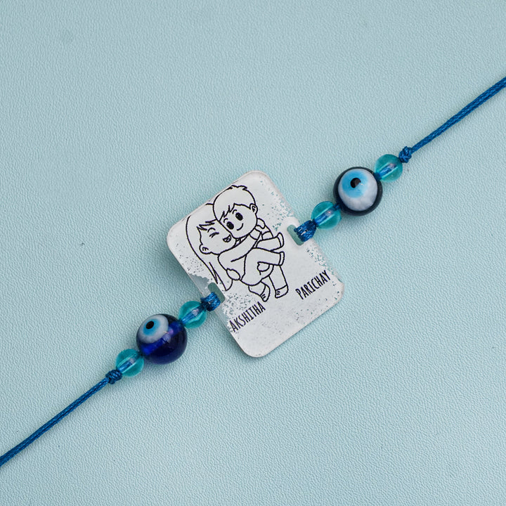 Personalized Handmade 3D Line Art Bro And Sis Evil Eye Beads Acrylic Rakhi With Roli Chawal - Engraving Close-up (3)