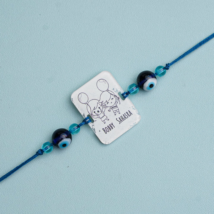 Personalized Handmade 3D Line Art Bro And Sis Evil Eye Beads Acrylic Rakhi With Roli Chawal - Engraving Close-up (9)
